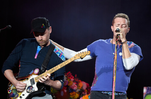 PHILADELPHIA, PA - SEPTEMBER 04: Jonny Buckland (L) and Chris Martin of Coldplay perform onstage during the 2016 Budweiser Made in America Festival at Benjamin Franklin Parkway on September 4, 2016 in Philadelphia, Pennsylvania. (Photo by Kevin Mazur/Getty Images for Anheuser-Busch)